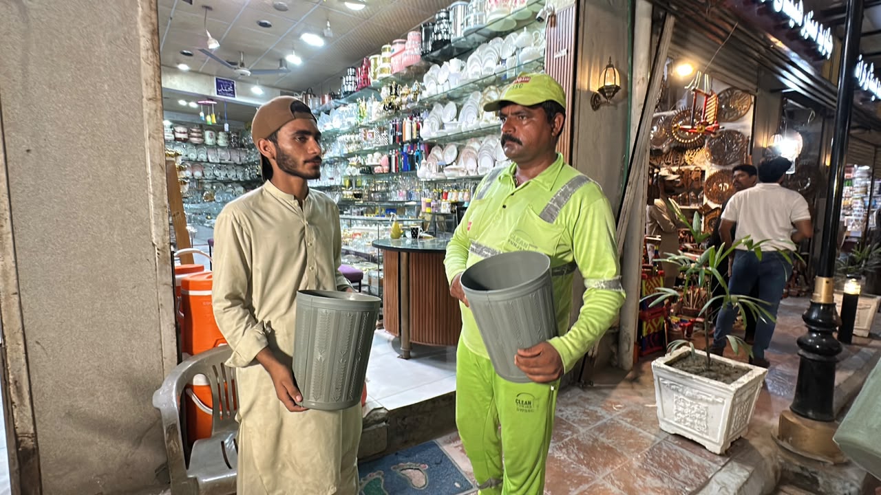Dustbin Handover to Shopkeepers